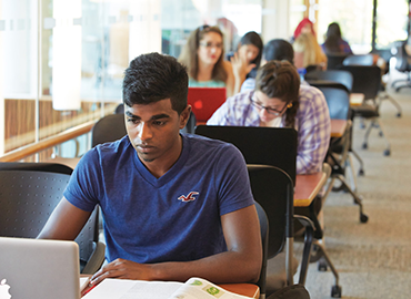 Student is working in front of the laptop