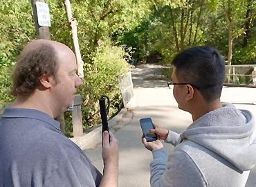 CNIB Foundation’s national lead in accessibility and assistive technology Jason Fayre with iMerciv co-founder and CEO Bin Liu testing MapinHood, a pedestrian routing app featuring audible alerts about hazards.